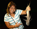 Lady with a Giant Catfish