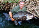 Peter with a Giant Siamese Carp.