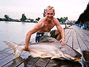 Happy angler with a Giant Mekong Catfish.